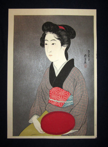 This is a very beautiful and rare Japanese Shin Hanga woodblock print “Woman Holding Red Dish” from the famous Shin-Hanga woodblock print artist Hashiguchi Goyo (1880-1921) published by the famous printmaker YuYuDo IN EXCELLENT CONDITION. 
